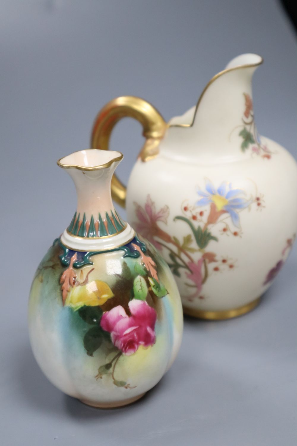 Four small items of Royal Worcester, including a flower-painted vase, No 283, a blush ivory jug, No 1094, a miniature tyg and a mug, ta